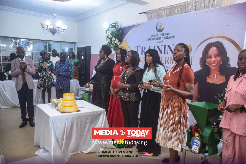Beneficiaries receiving business equipment during the empowerment programme.