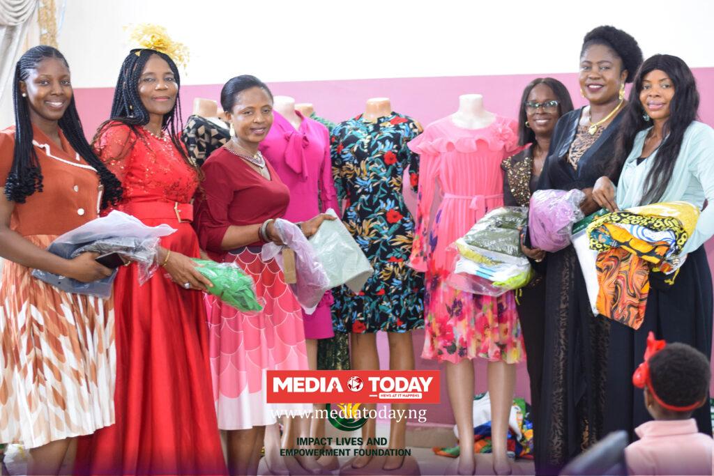 Beneficiaries receiving business equipment during the empowerment programme.