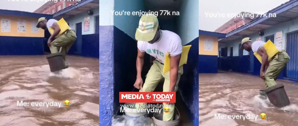 “The Struggle Is Real”- Corper Goes Viral After Using Plastic Buckets To Cross Flood On Way To PPA